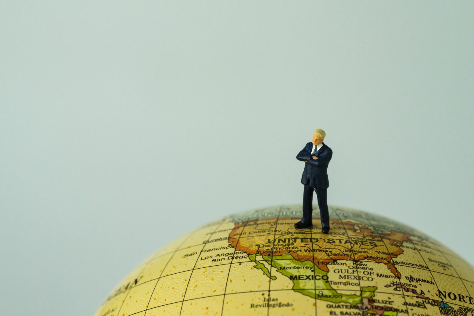 Miniature,People,Figure,Businessman,President,Standing,On,United,States,Of