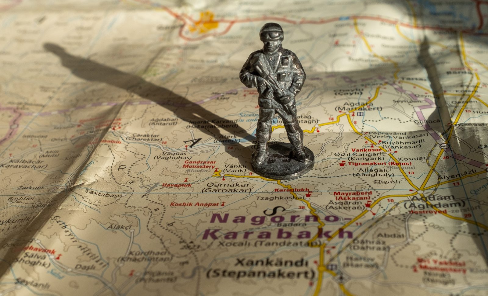 A,Figurine,Of,An,Armed,Soldier,On,The,Map,Of