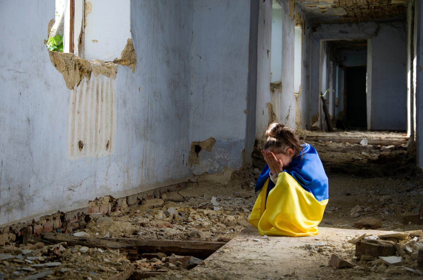 Children of War in Ukraine. Start A child in a destroyed house. Ukrainian children during the war.