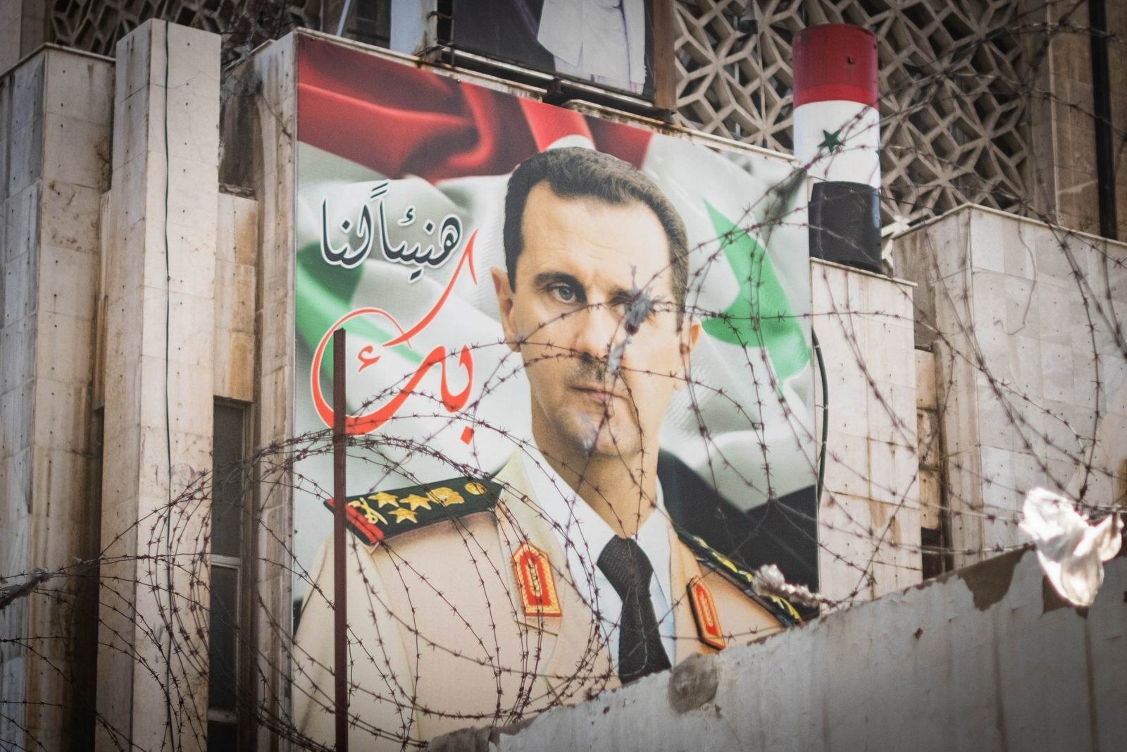 Syria post Assad priorities for peace Damascus Syria May 2023 Poster with Syrian President Bashar Al Assad on building facade