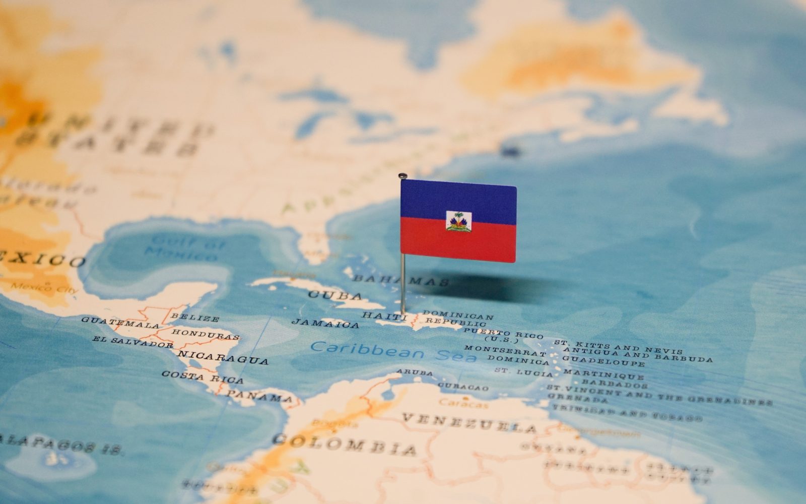 Haiti violence instability Start The flag of Haiti on the world map.