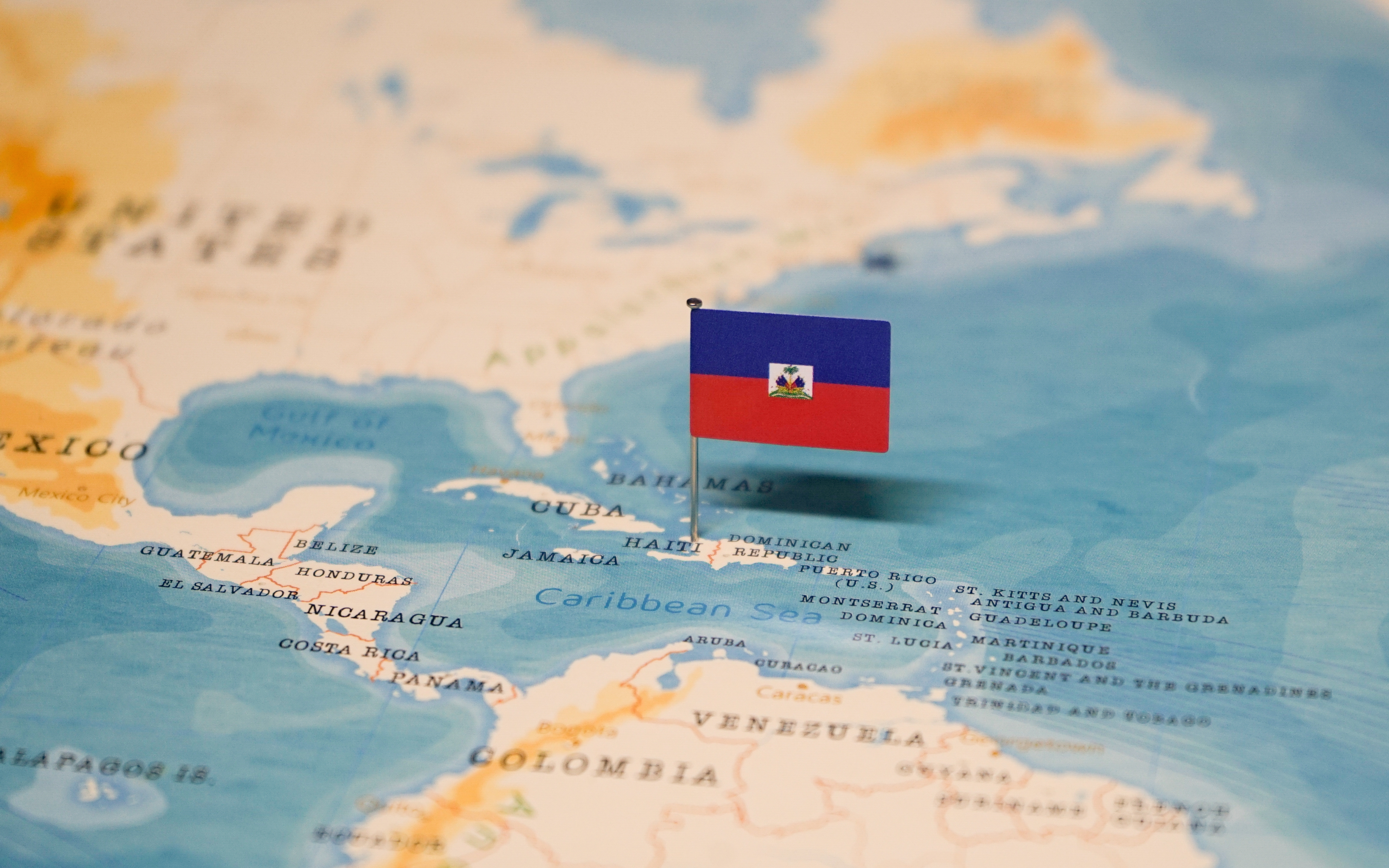 Haiti violence instability Start The flag of Haiti on the world map.