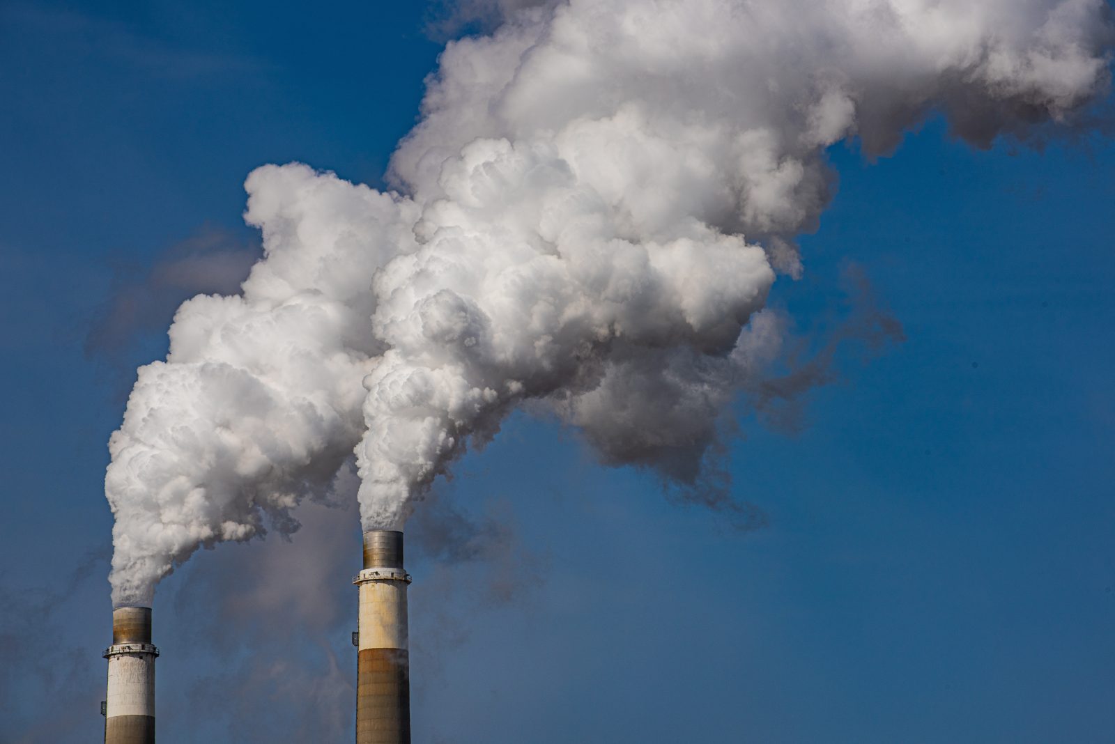 Climate crisis emissions threshold 2024 Start Exhaust stacks from coal fired power plant emitting waste products to atmosphere.