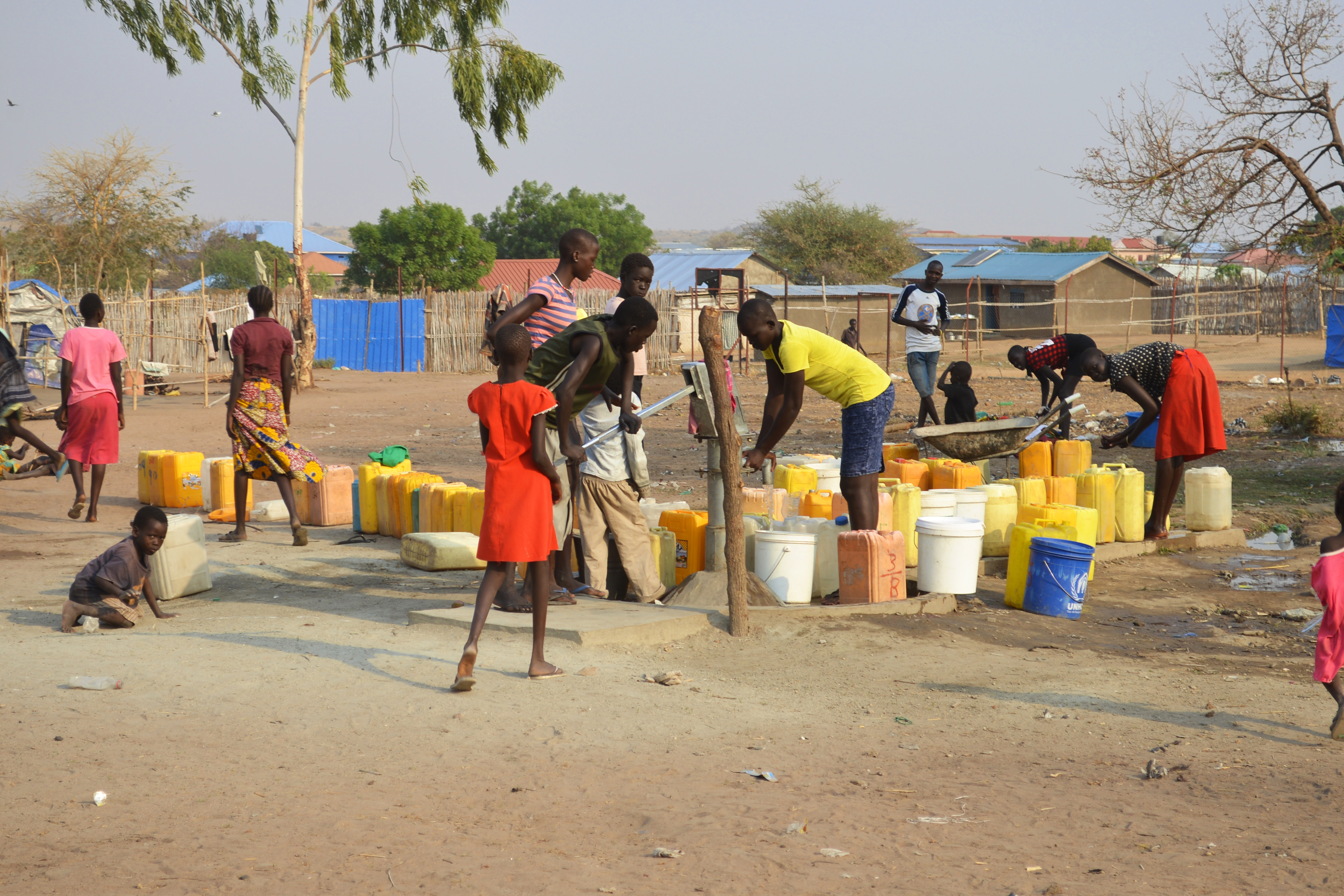 Sudan Civil War One Year Famine And Crisis Juba South Sudan February 2017 People with yellow jerrycans waiting for water at a borehole site Salesian camp for internally displaced persons