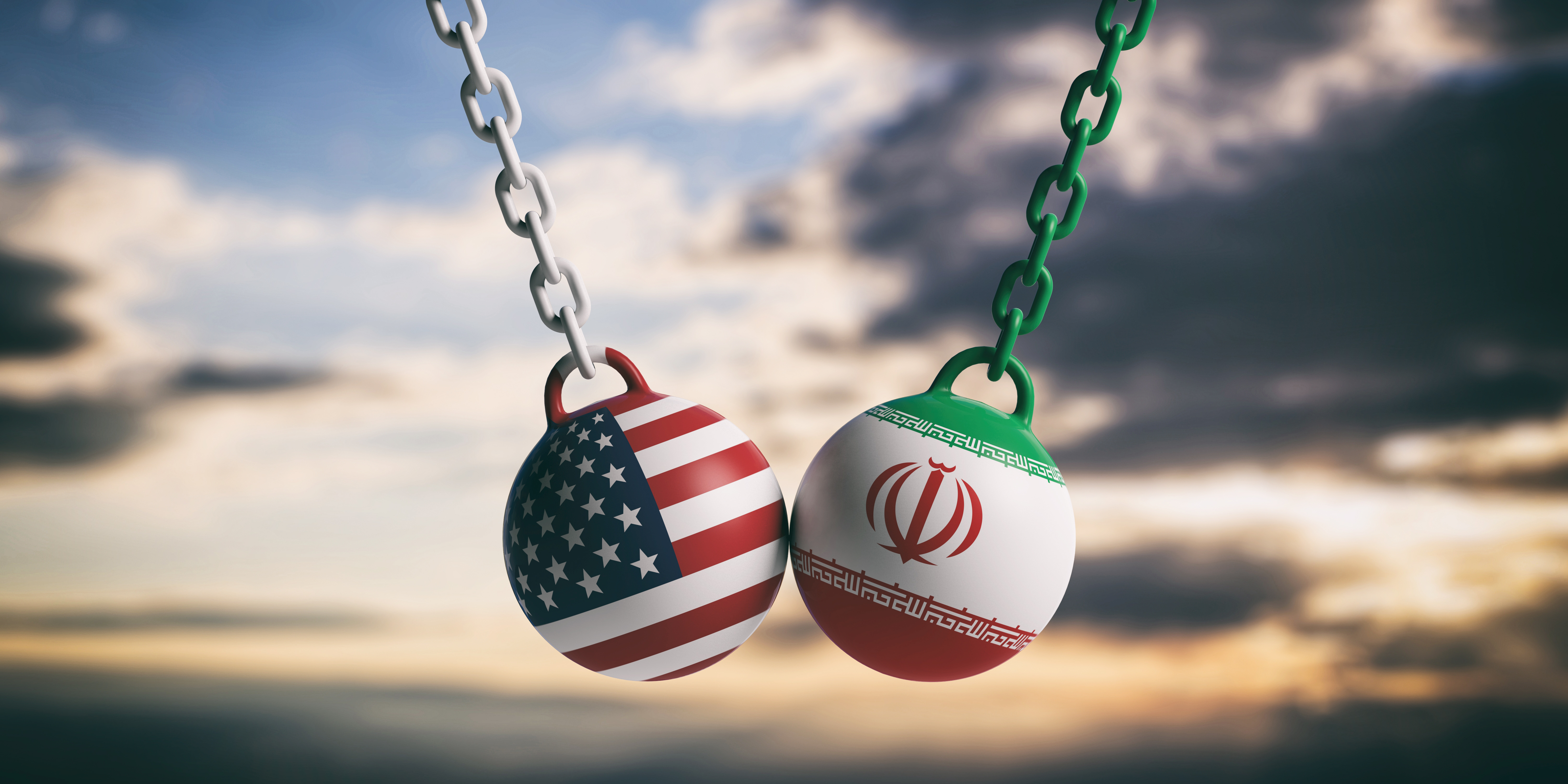 Iran US Relations Start US of America and Iran relations. USA and Iranian flags wrecking balls swinging on blue cloudy sky background. 3d illustration
