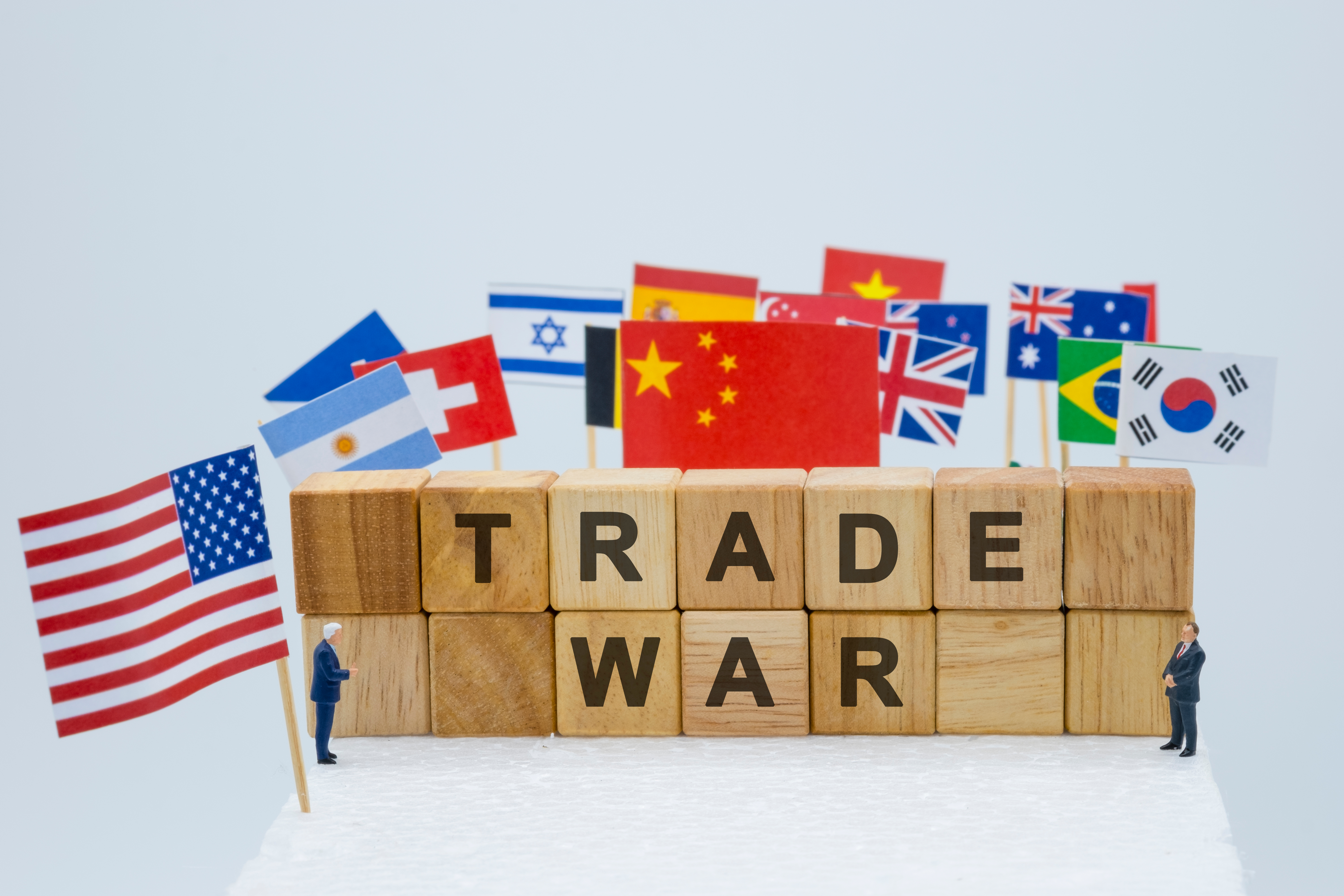 Trade Tariff Economic Coercion Trade war wording with USA China and multi countries flags. It is symbol of tariff trade war crisis or unfair business .-Image.