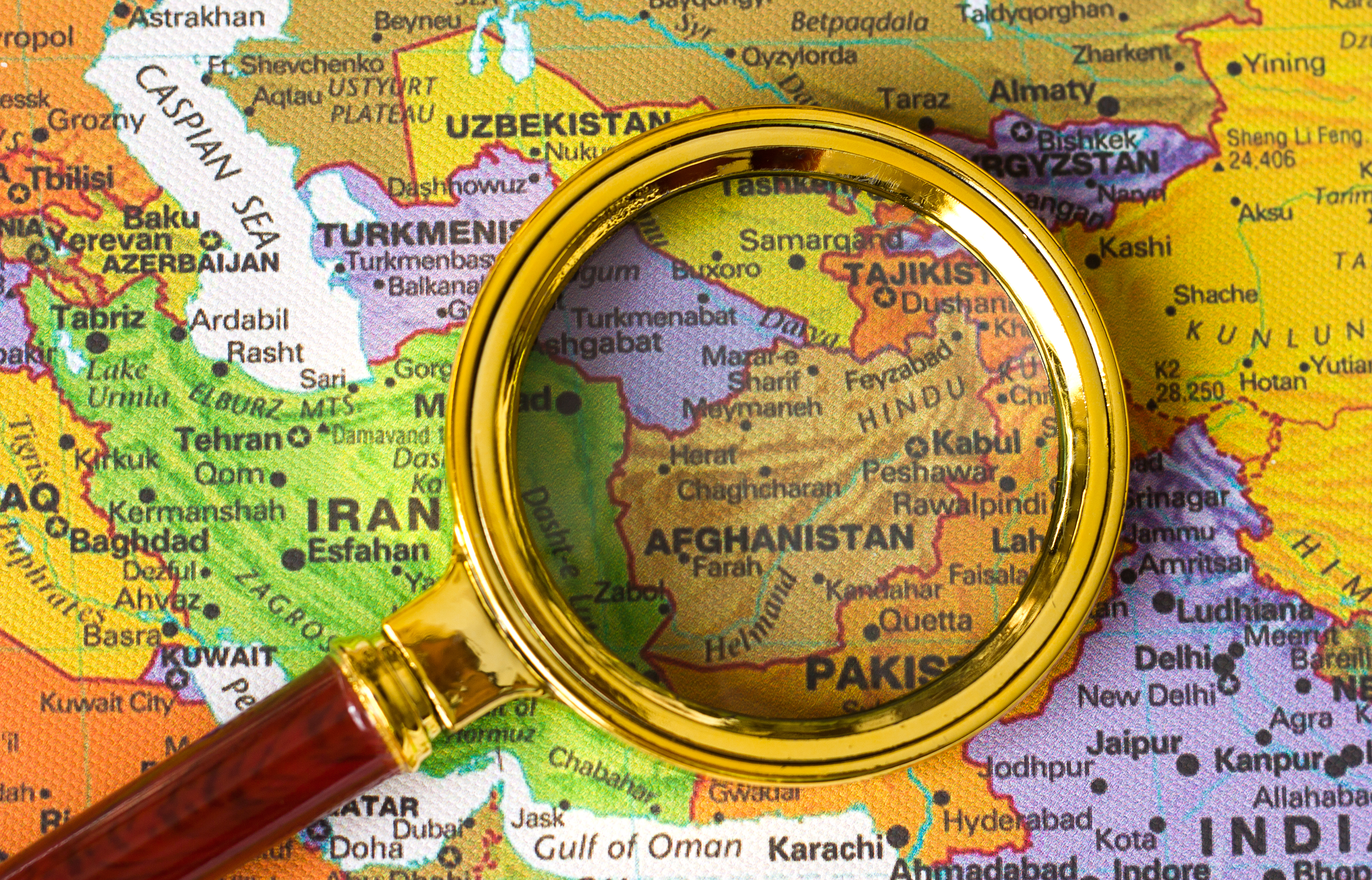Afghanistan Taliban Recognition Start Afghanistan a map of Asia in a defocused magnifying glass, the theme of travel and trips to Afghanistan, Kabul, selective focus