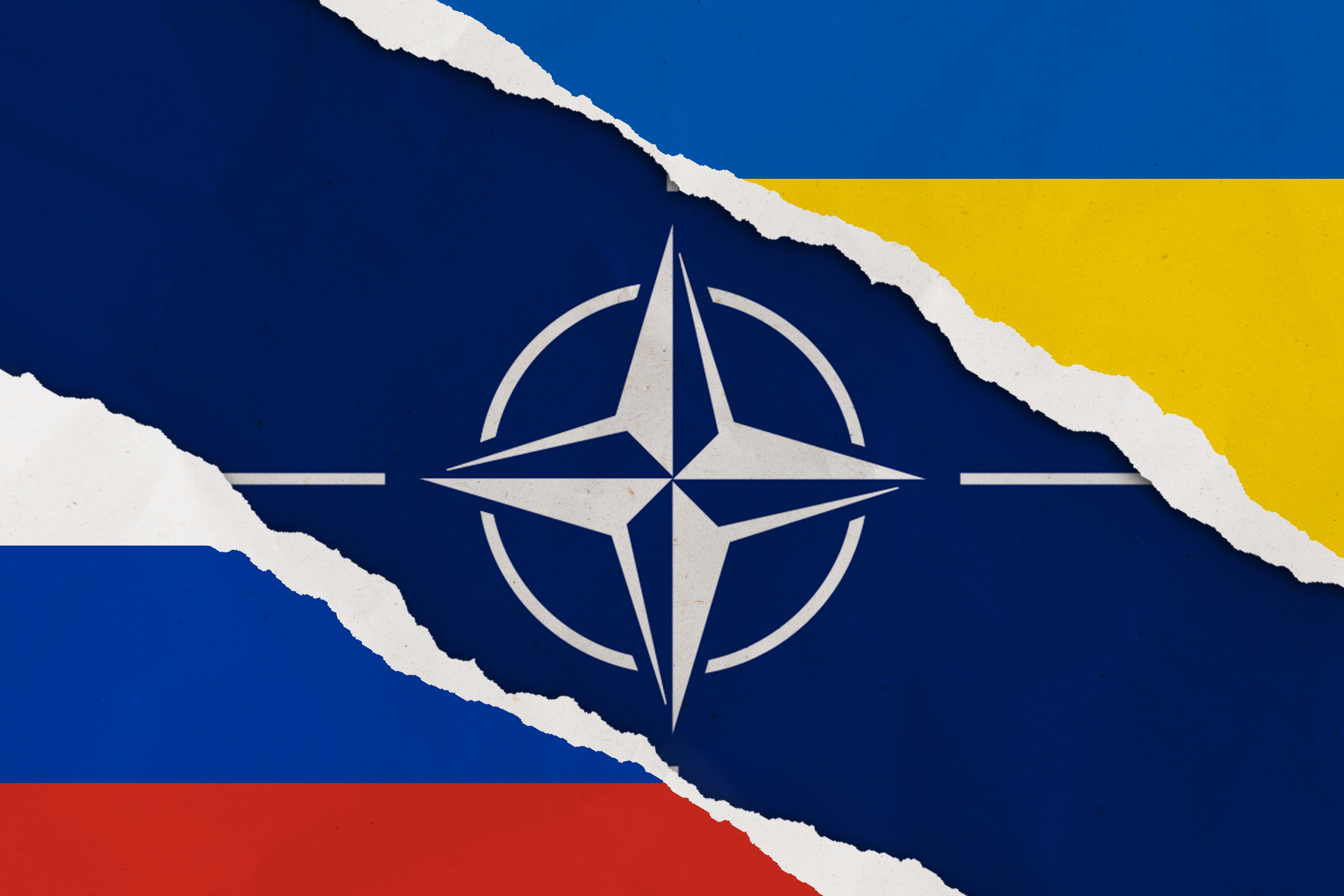 NATO and Russian Federation in Ukraine Start Istanbul, Turkey - February, 24, 2022: Ukraine, Russia, NATO flag ripped paper grunge background. Abstract Ukraine Russia politics conflicts, war concept texture background