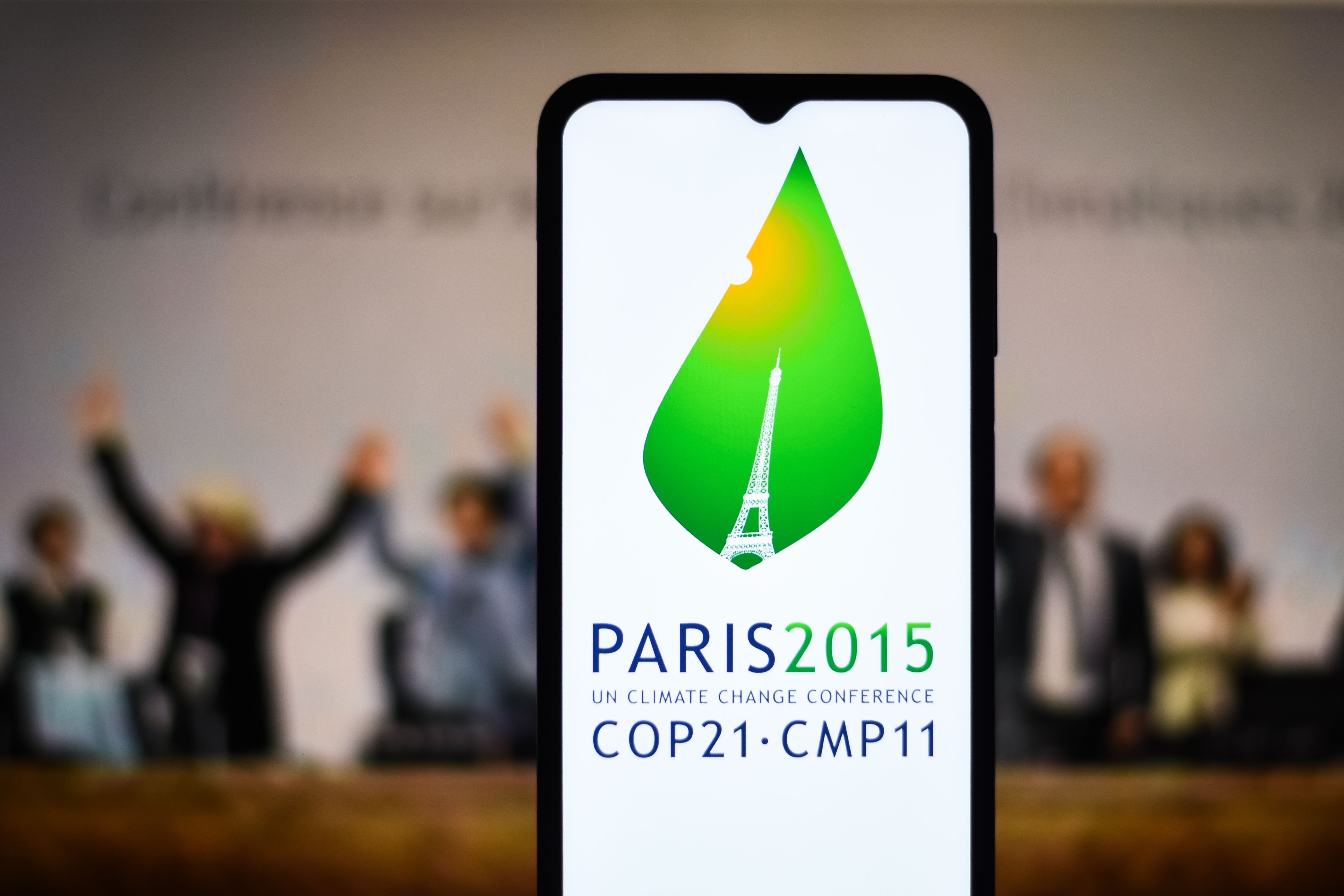 Paris Agreement Overshoot Generation Start Selective focus of the 2015 United Nations Climate Change Conference, COP 21 or CMP 11 logo on a mobile screen stock image: Dhaka, BD- Feb 27, 2024