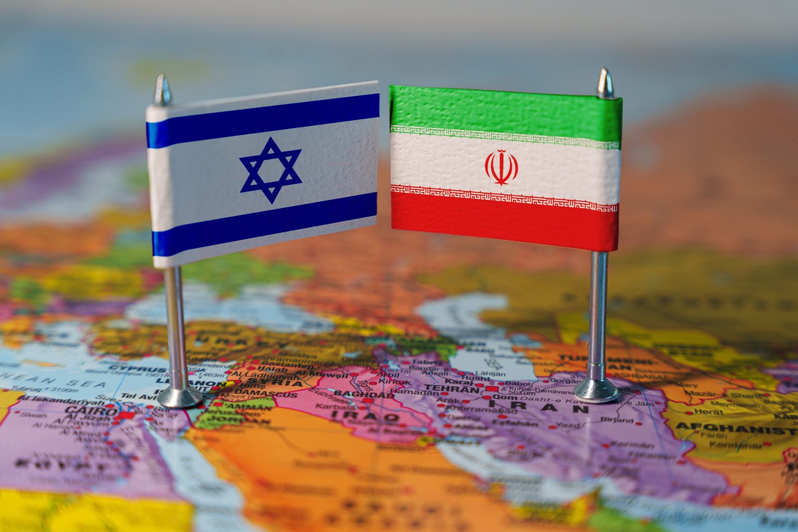 Iran Israel Threshold War on Middle East map with flags in background