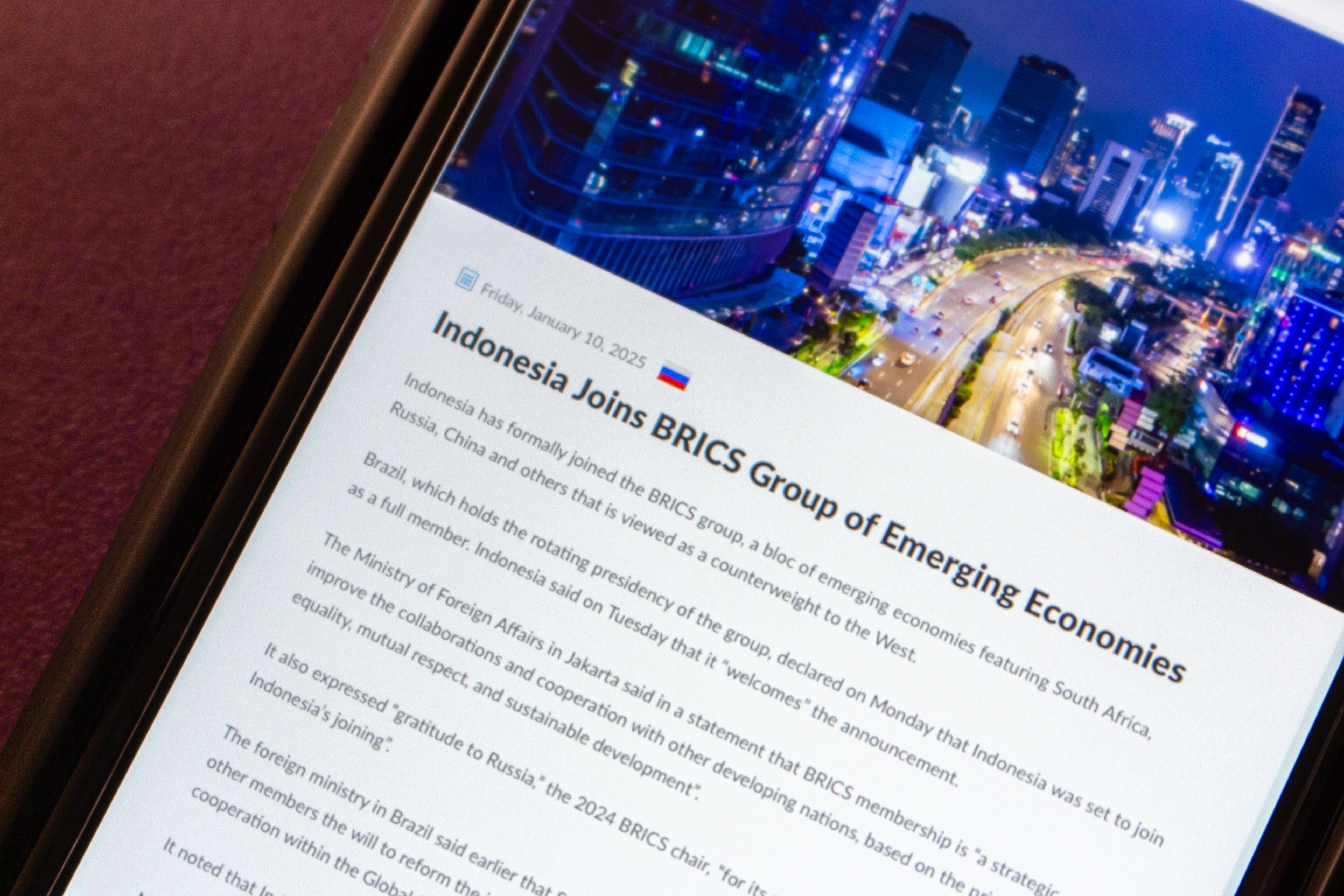 Indonesias membership in BRICS Start Mexico City, MEXICO - Jan 14 2025 : A post titled Indonesia Joins BRICS Group of Emerging Economies is displayed on an iPhone from the BRICS website