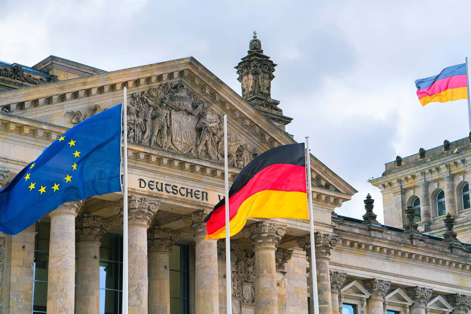 Germany EU leadership depicted by Reichstag with German and EU flags in Berlin