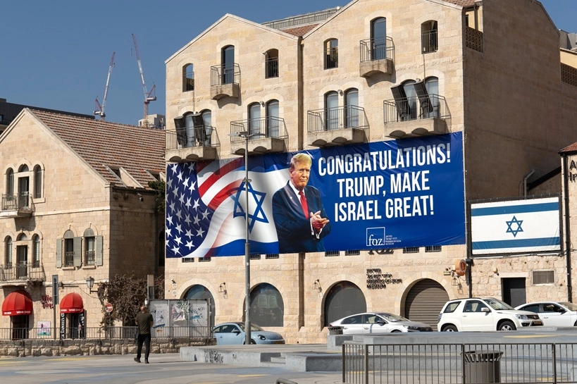 Trump congratulatory banner on building in Jerusalem, symbolizing the Israeli State Influence On US Policy