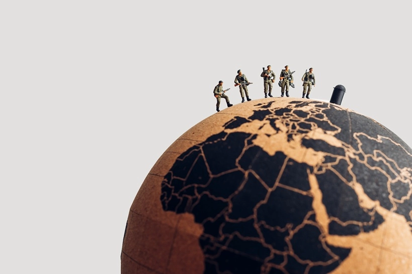 Group of soldiers on top of the earth globe. Military concept highlighting terrorist groups in the Sahel