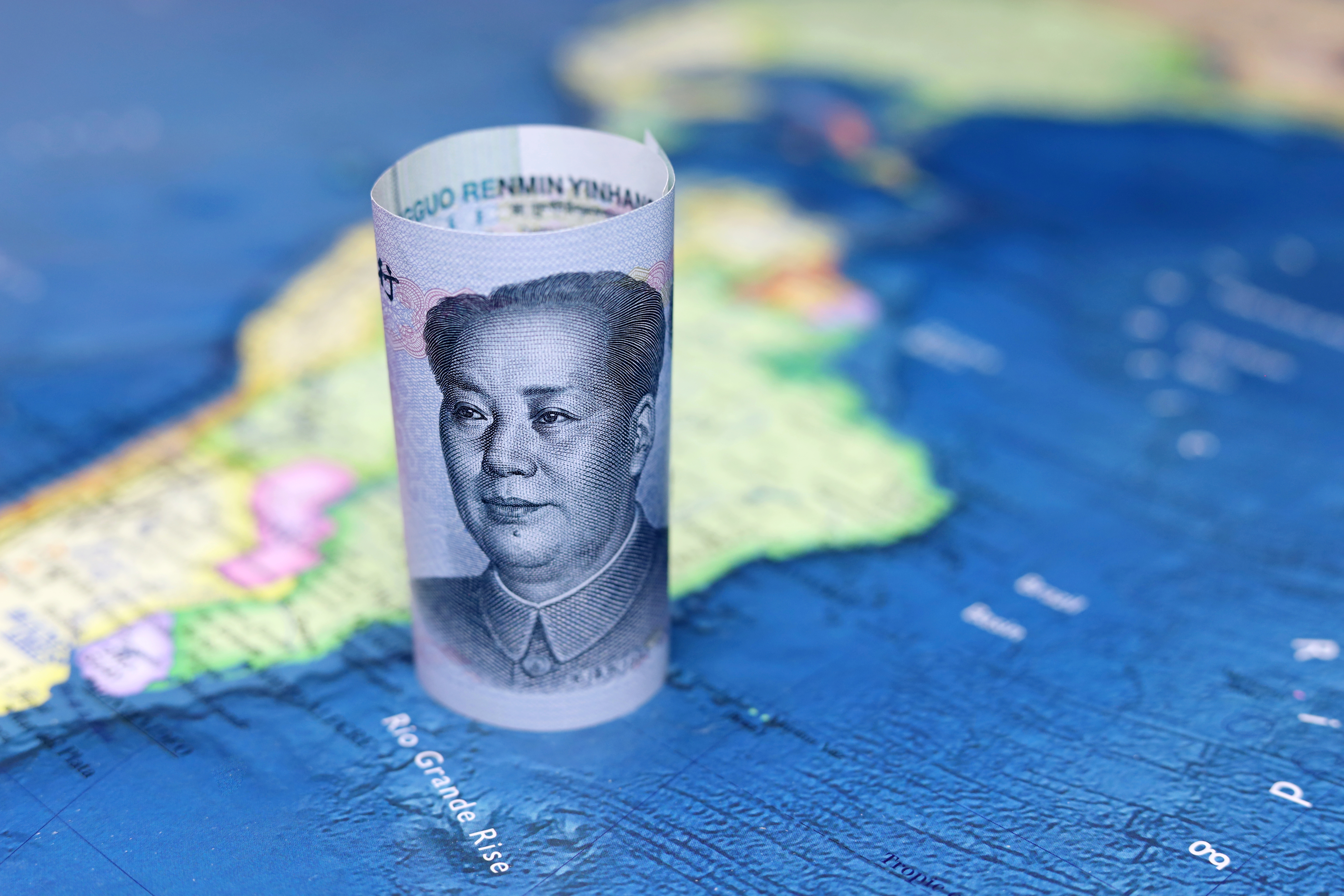 Chinese yuan on South America map symbolizing China Latin America green cooperation