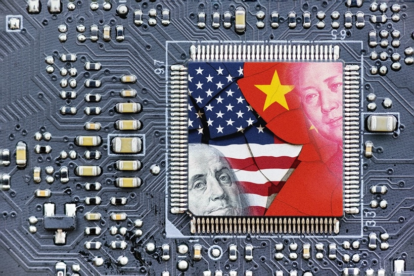 AI Great Power Paradox US China Tech Rivalry Start Flag of USA and China on a processor, CPU or GPU microchip on a motherboard. US companies have become the latest collateral damage in US - China tech war. US limits, restricts AI chips sales to China.