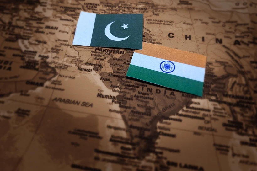 Comparative analysis of India and Pakistan foreign policy start India vs Pakistan conflict concept background with flags and map in backdrop political war trade sports