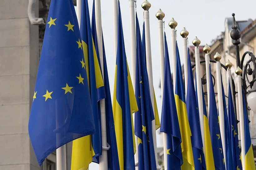 EU guarantees on Ukraine security assessment start flags of Ukraine and European Union on flagpoles near office of President of Ukraine Kyiv