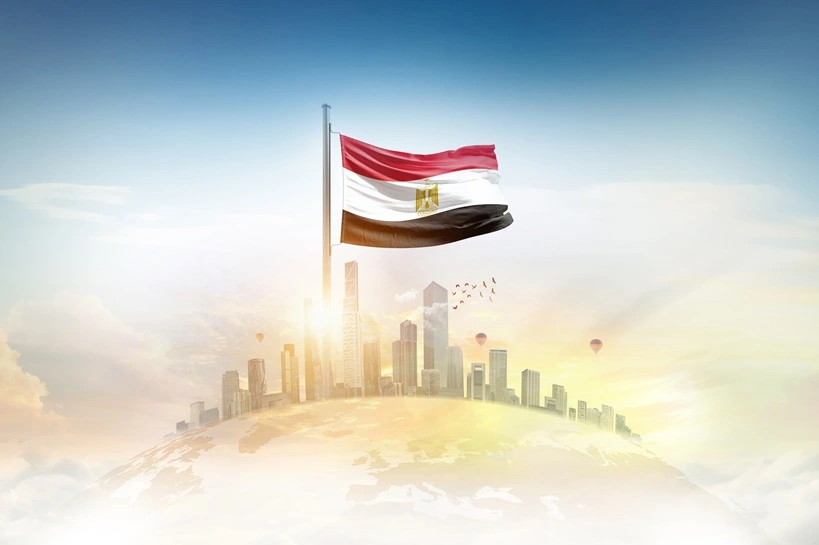Egypt flag wavering on blobe with modern building skyline. Flag waving on world map. Egypt national flag for independence day.