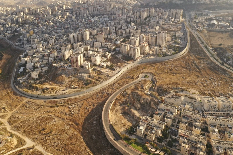 "Israel and Palestine divided by Security wall Aerial view Aerial view of Left side Anata Palestinian town and Israeli neighbourhood Pisgat zeev"