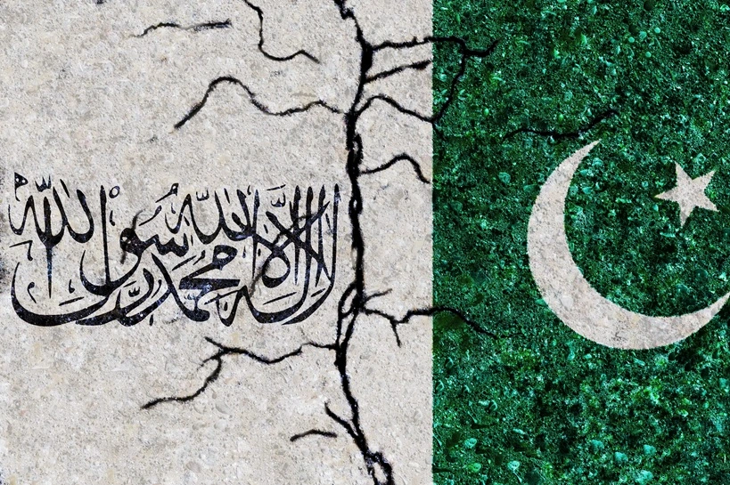 Cracks in the texture wall. Flags: Pakistan, Taliban. Afghanistan civil war. Islamic Emirates of Afghanistan. Pakistan-Taliban relations