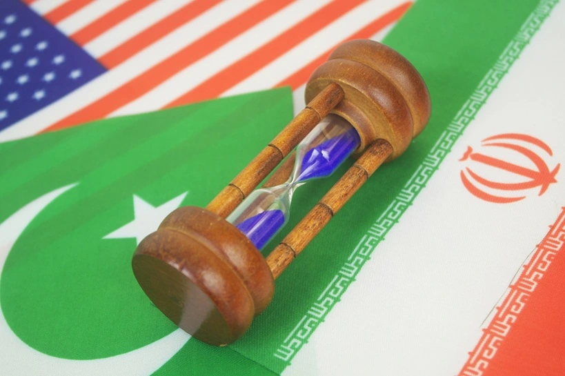 Flags of America, Pakistan and Iran under hourglass. Negotiation of USA and Iran in Pakistan.
