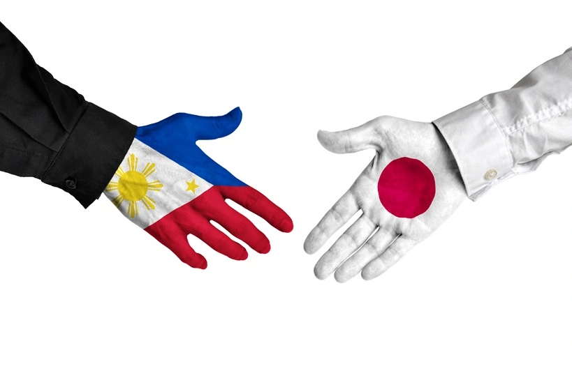 Philippines and Japan leaders shaking hands on a deal agreement. Source: Shutterstock