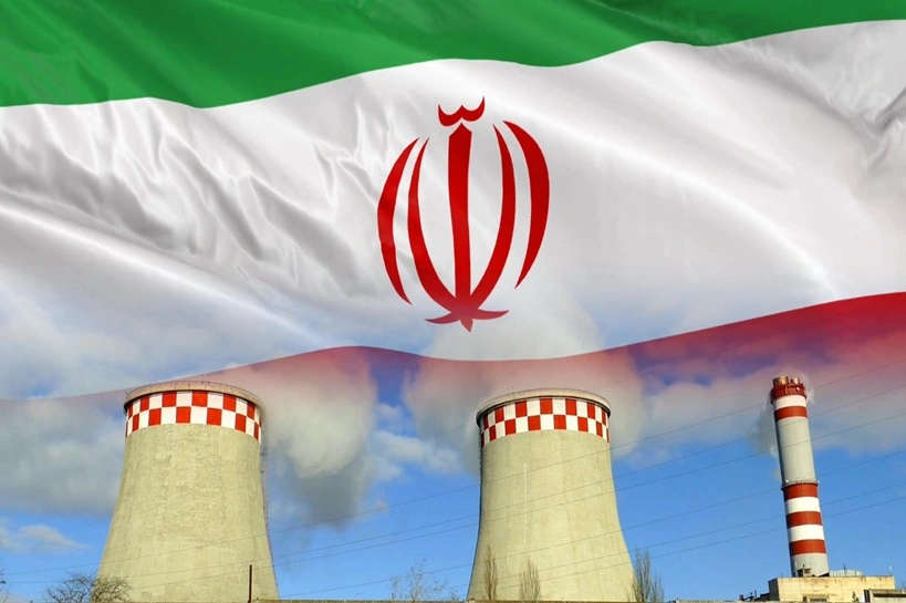 The Iranian flag is superimposed on an industrial nuclear power plant to illustrate the Atomic Energy Program and the implications of nuclear power. Source: Shutterstock