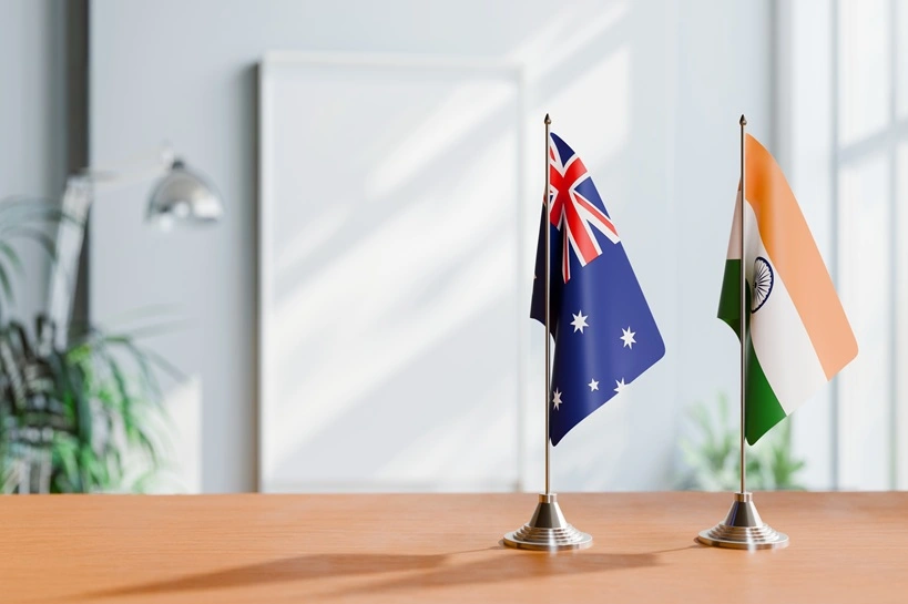 FLAGS OF AUSTRALIA AND INDIA ON TABLE. Source: Shutterstock