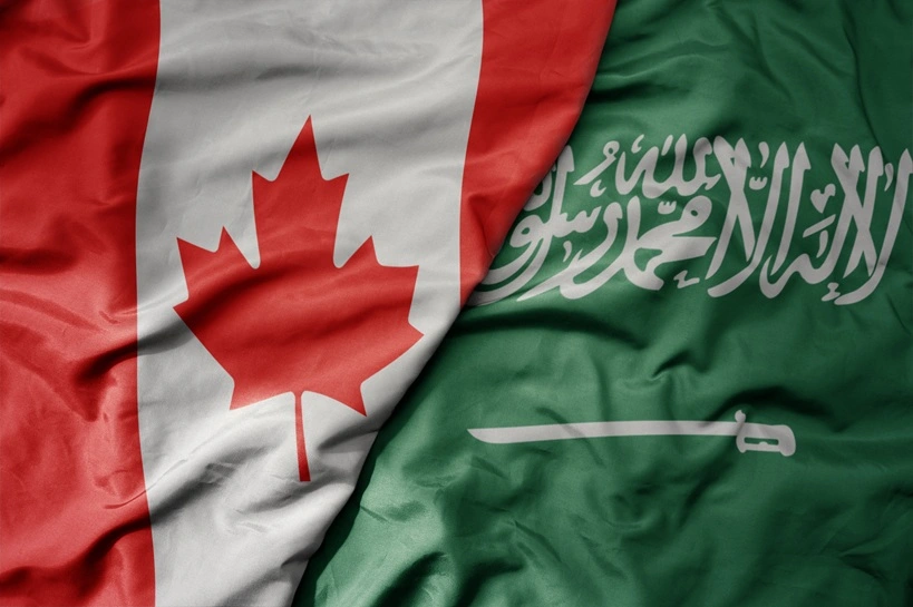 big waving realistic national colorful flag of canada and national flag of saudi arabia . macro. Source: Shutterstock
