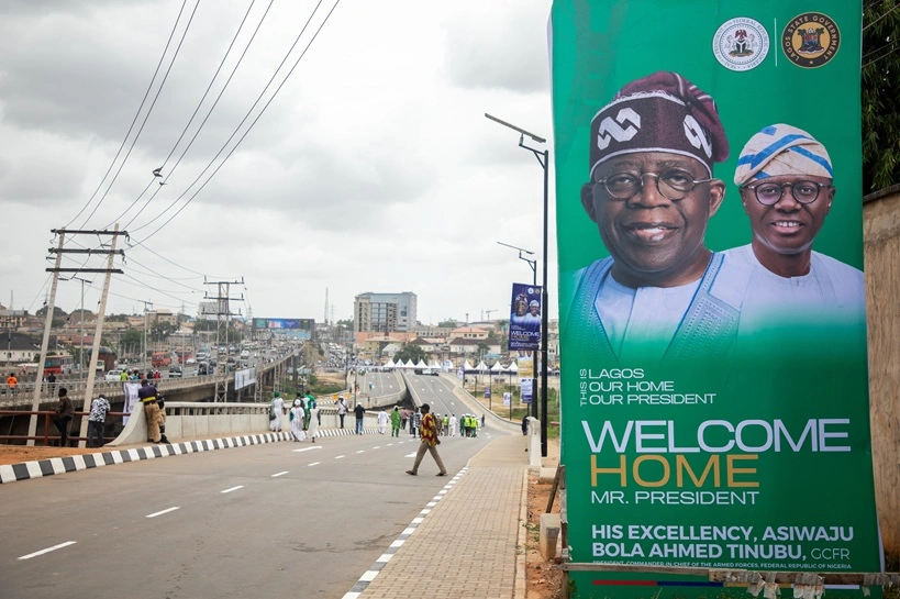 A wide view of the newly commissioned Ojota-Opebi Link Bridge is seen lined with banners welcoming Bola Ahmed Tinubu in Ikeja, Lagos, Nigeria, on April 8, 2026. The roadway forms part of infrastructure projects aimed at improving connectivity and easing traffic in the area. Source: Shutterstock