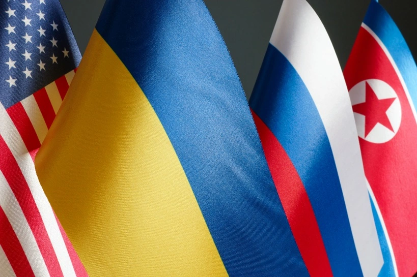 Flags of the USA, Ukraine, Russia and North Korea. Conflict and geopolitical tensions. Source: Shutterstock