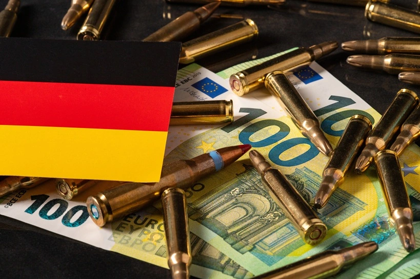 Euro Money, Bullets, and German Flag Representing Germanys Military Spending and Role in European Defense 20. Source: Shutterstock