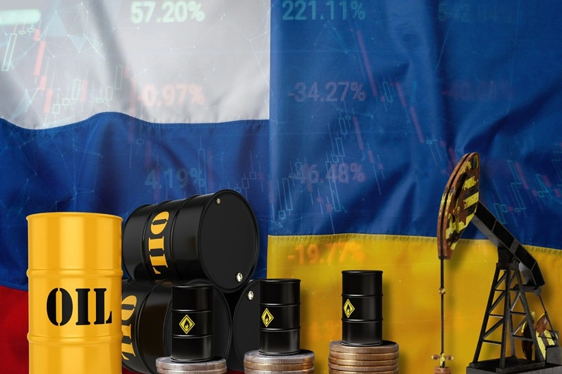 Russia and Ukraine Flags with Oil Barrels, Pumpjack, Coins, and Stock Charts Illustrating the Geopolitical Energy Conflict and Economic Market Volatility. Source: Shutterstock