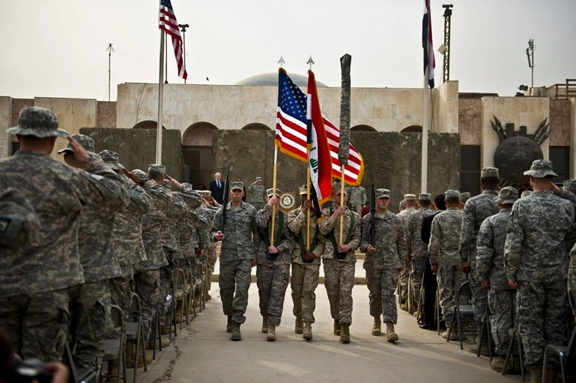 The colors are retired during a ceremony marking the end of the U.S. mission in Iraq in Baghdad on Dec. 15, 2011. English: Erin A. Kirk-Cuomo, Public domain, via Wikimedia Commons